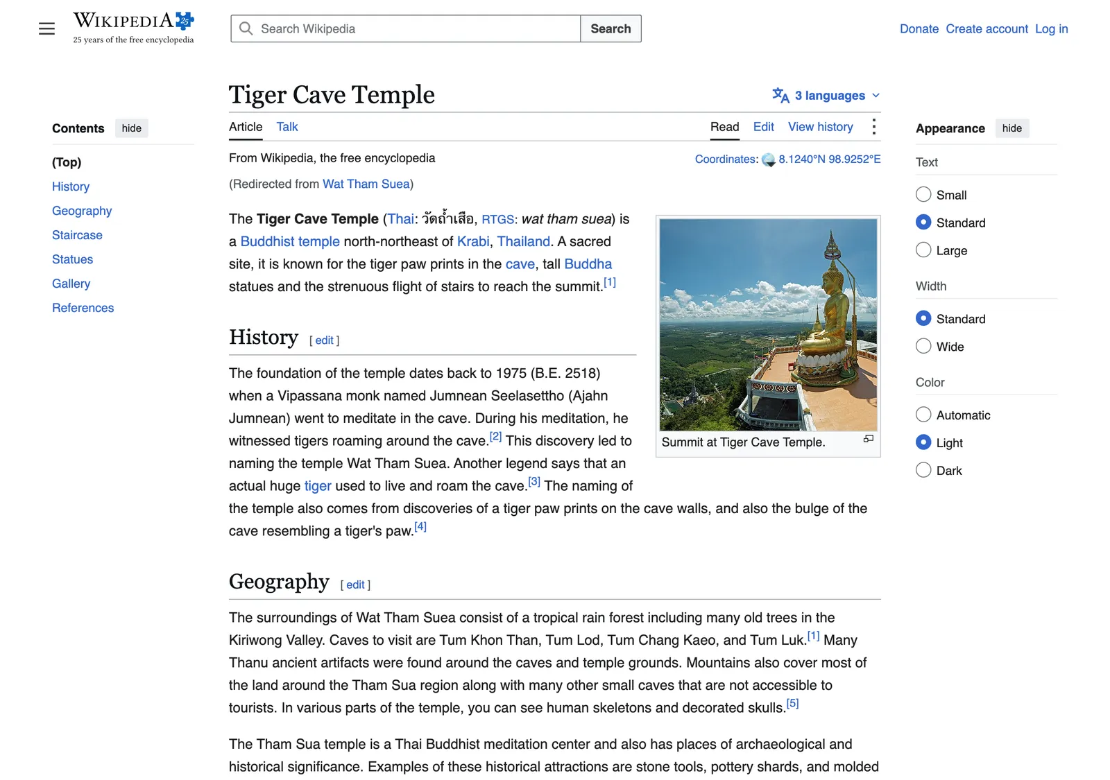 Encyclopedia article on the Tiger Cave Temple with a contents list, a history section and a photo of a golden temple statue on a hill.