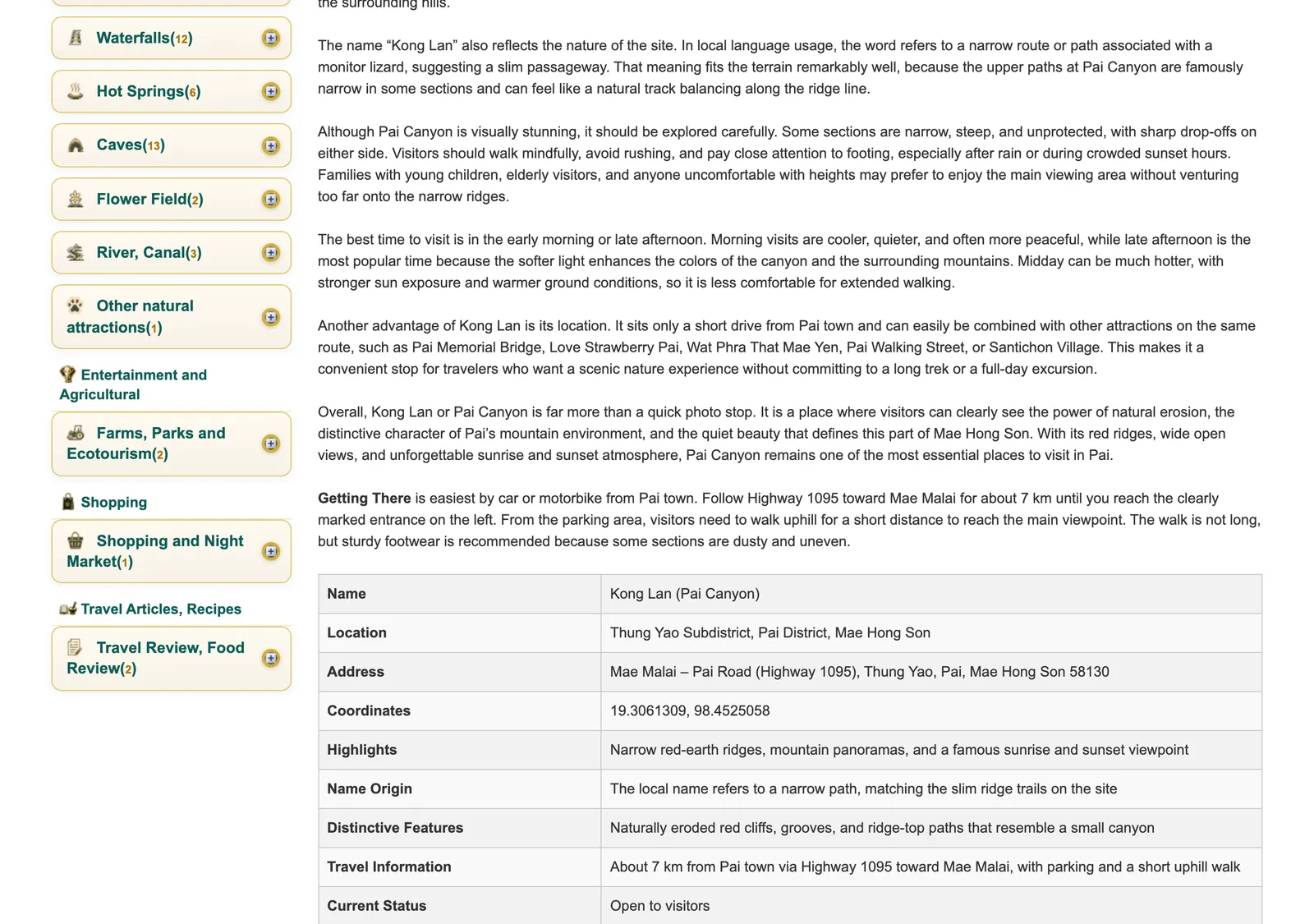 Guide-site page for the red-earth canyon viewpoint, with the getting-there paragraph and an information table with its name, location and address.
