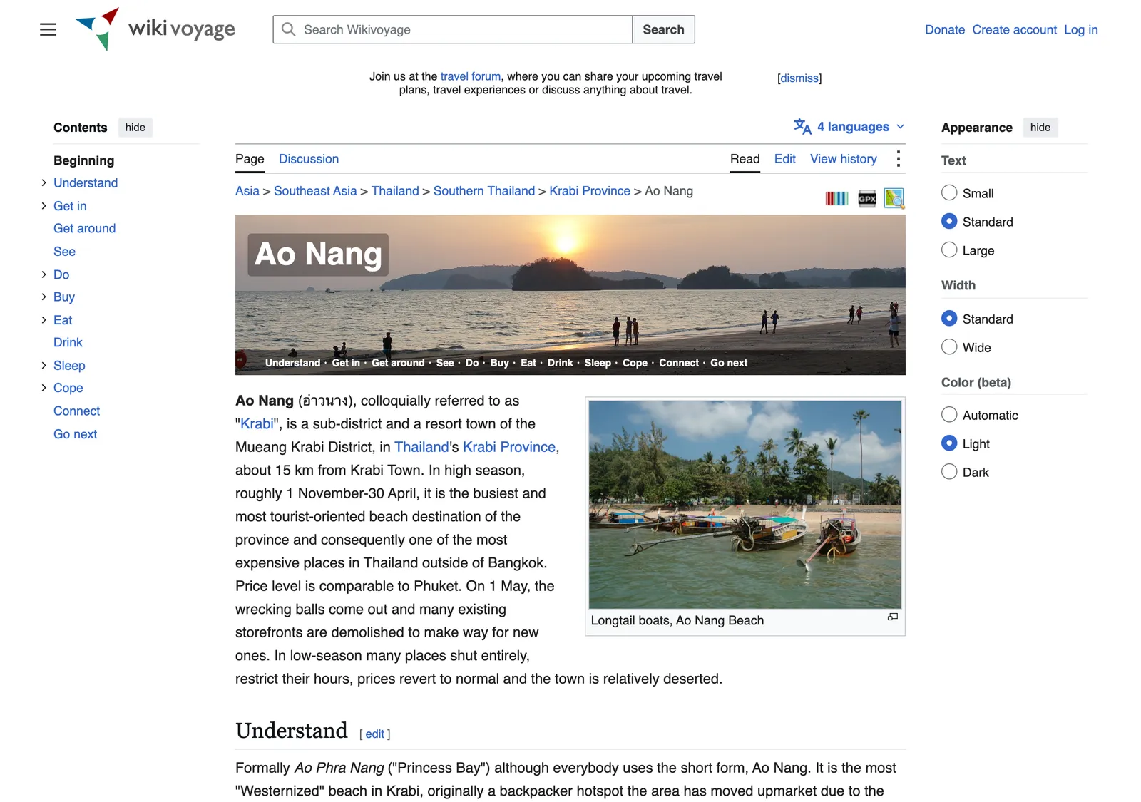 Travel wiki page for Ao Nang with a sunset banner, a contents list and a photo of longtail boats on the beach.